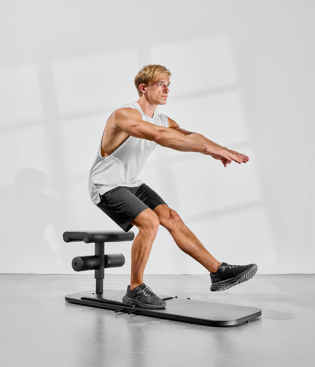 pistol squat sur banc de musculation eric flag
